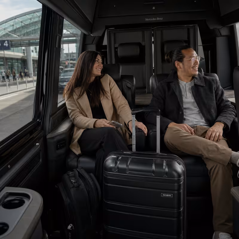 Passengers loading luggage while boarding an San Francisco group shuttle